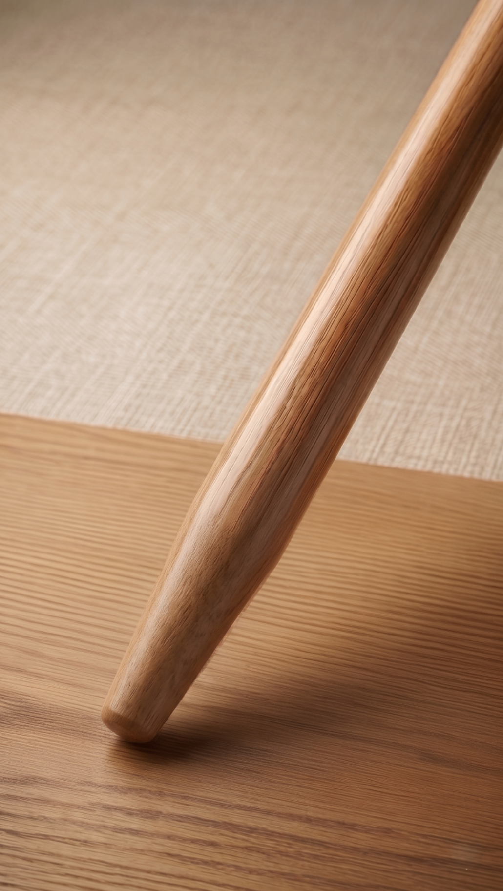 Hardwood broom handle with smooth tapered end for friction fit